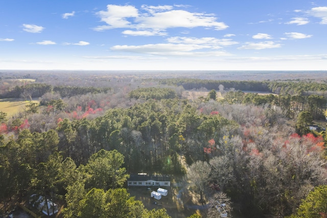 birds eye view of property with a wooded view