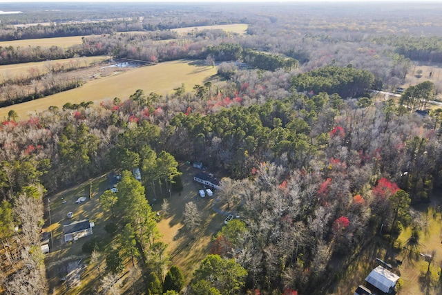 bird's eye view with a rural view and a wooded view