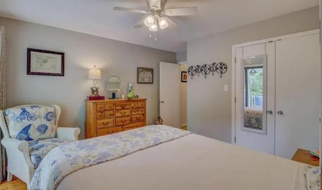 bedroom with ceiling fan and a closet