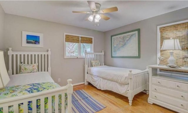 bedroom featuring light wood-type flooring and ceiling fan