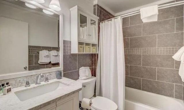 full bathroom featuring tile walls, vanity, shower / bath combo, and toilet