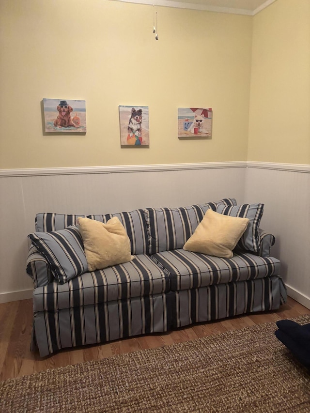 living room featuring ornamental molding and dark wood-type flooring