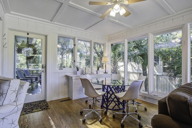 sunroom / solarium with beam ceiling, ceiling fan, and coffered ceiling