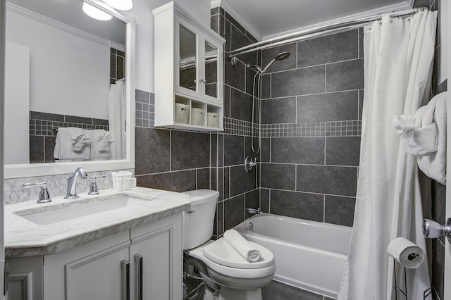 full bathroom with shower / tub combo, ornamental molding, vanity, tile walls, and toilet