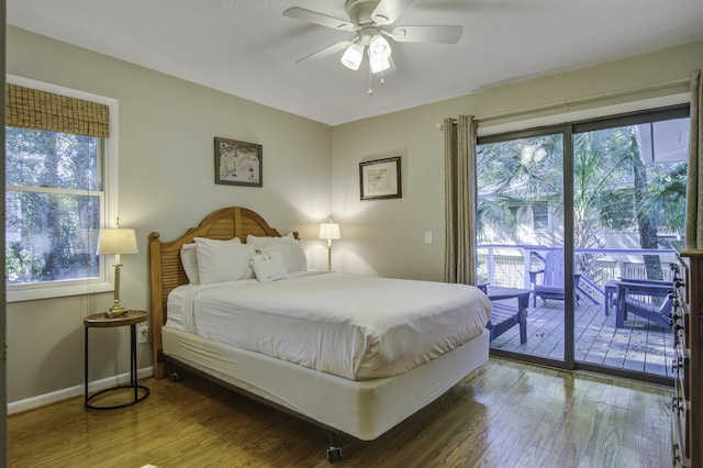 bedroom with ceiling fan, wood-type flooring, and access to outside