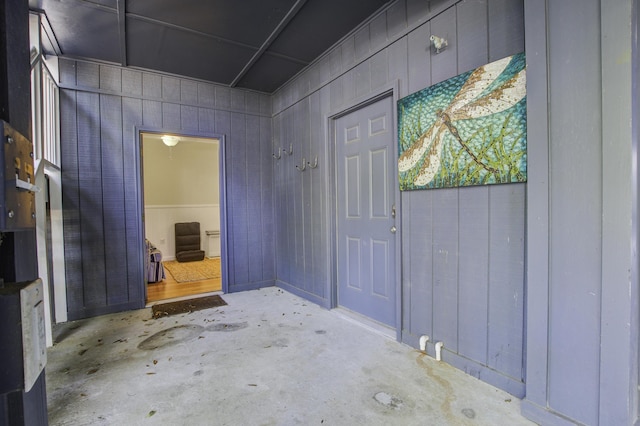 foyer entrance with wood walls