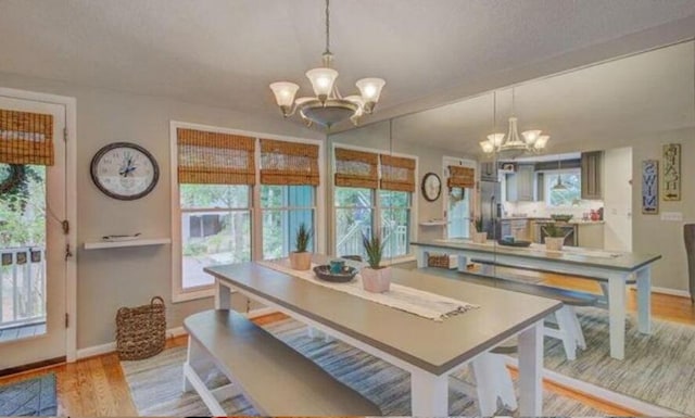 dining area featuring a chandelier and light hardwood / wood-style floors