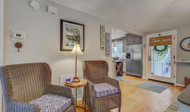 sitting room with light hardwood / wood-style flooring