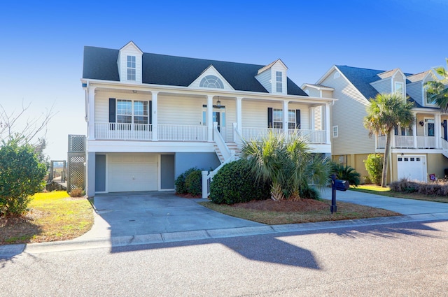 view of front of home featuring covered porch and a garage