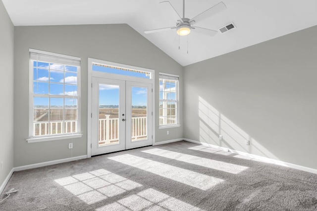 unfurnished room featuring lofted ceiling, light colored carpet, ceiling fan, and french doors