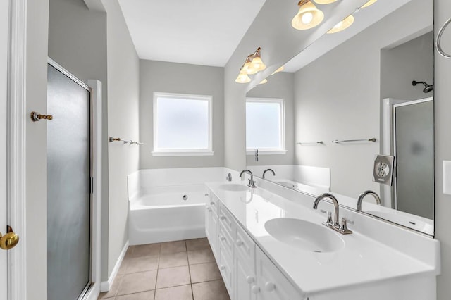 bathroom with vanity, plus walk in shower, and tile patterned flooring