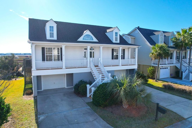 view of front facade with a porch and a garage