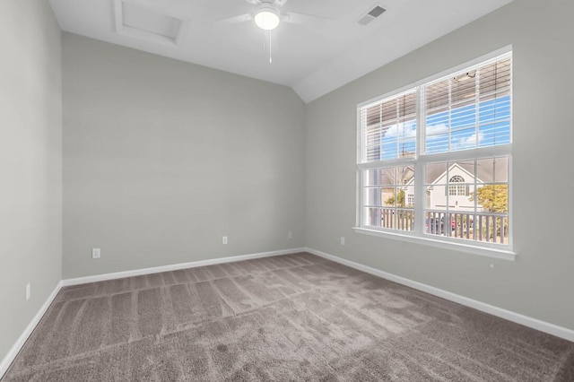 unfurnished room featuring vaulted ceiling, carpet flooring, a wealth of natural light, and ceiling fan