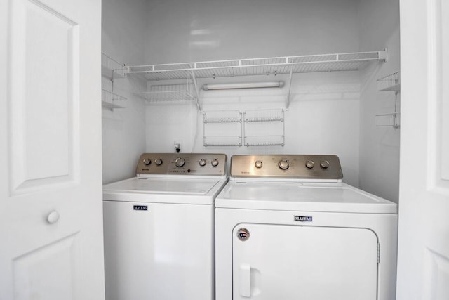 laundry room with washing machine and dryer