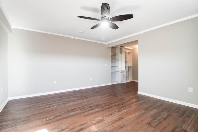 spare room featuring ornamental molding, dark wood-type flooring, and ceiling fan