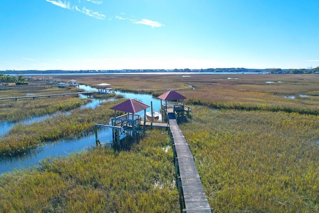 aerial view with a rural view and a water view