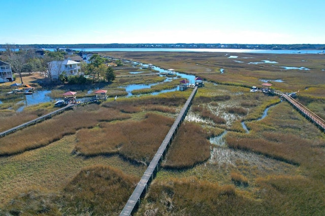 birds eye view of property featuring a water view and a rural view