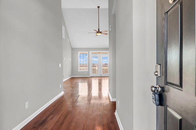 entrance foyer featuring dark hardwood / wood-style flooring, lofted ceiling, and ceiling fan