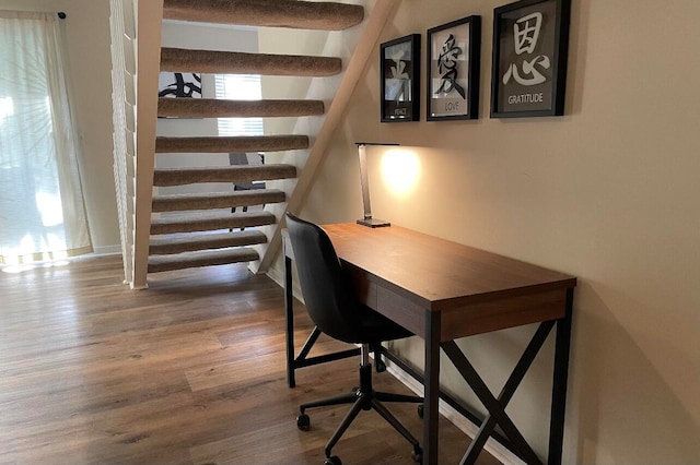 office area featuring a wealth of natural light and hardwood / wood-style flooring