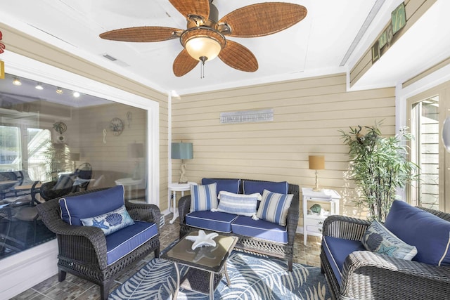 view of patio featuring visible vents, an outdoor hangout area, and a ceiling fan