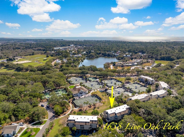 bird's eye view featuring a water view and a wooded view