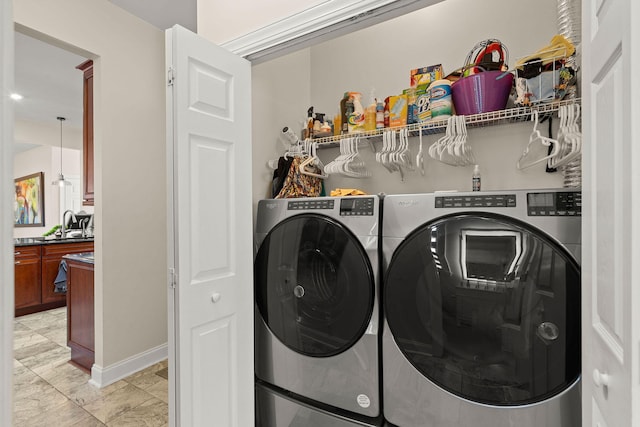 clothes washing area featuring washer and dryer