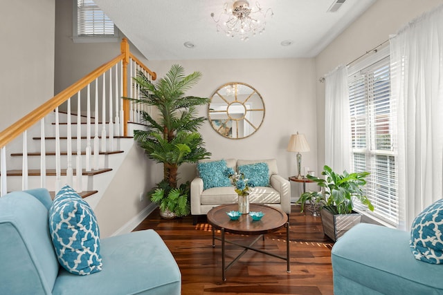 interior space featuring a notable chandelier and dark hardwood / wood-style flooring