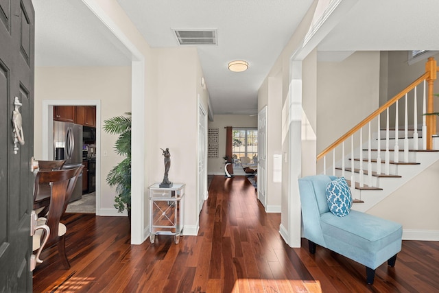 foyer with dark hardwood / wood-style flooring