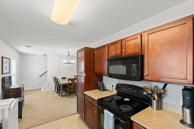 1170 Deerberry Rd, Hanahan, SC 29410 - kitchen featuring black appliances, light countertops, a chandelier, and light colored carpet
