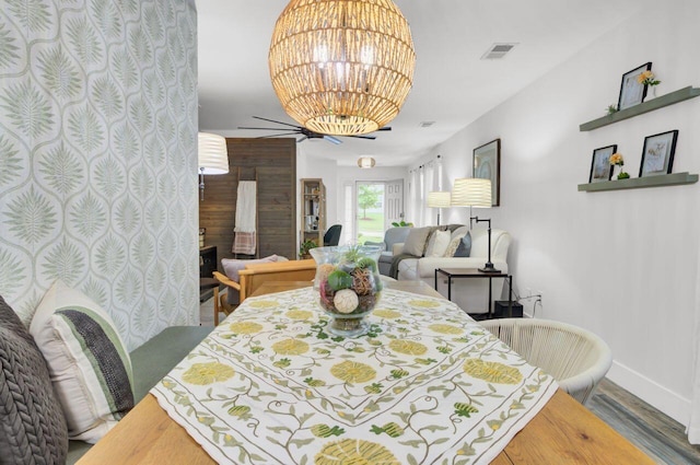 100 Runnels Cv, Summerville, SC 29485 - dining area featuring baseboards, wood finished floors, and a chandelier