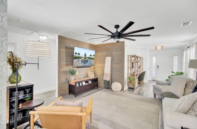 100 Runnels Cv, Summerville, SC 29485 - living area with ceiling fan, wooden walls, baseboards, wood finished floors, and attic access