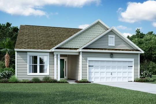 view of front of house featuring a front yard and a garage