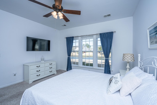 bedroom featuring a ceiling fan, carpet, visible vents, and baseboards