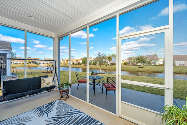 sunroom with a water view