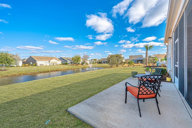 view of patio featuring a residential view and a water view