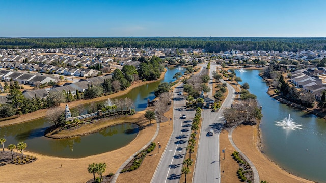 birds eye view of property with a residential view and a water view