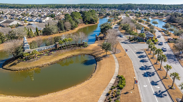 aerial view with a residential view and a water view