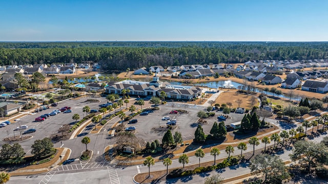 drone / aerial view with a residential view and a water view