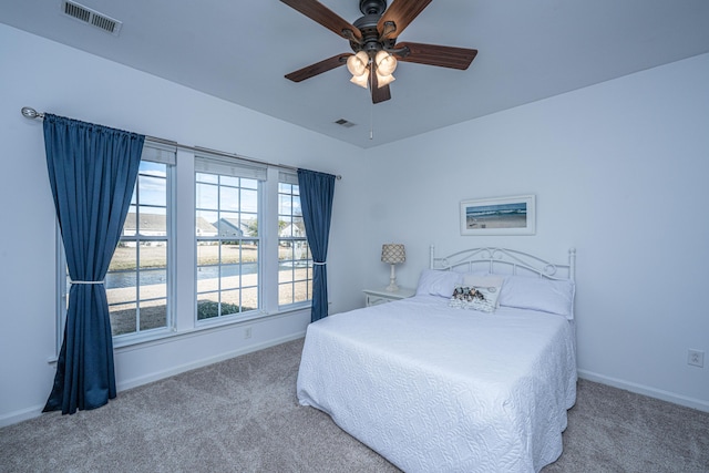 bedroom with visible vents, baseboards, and carpet flooring