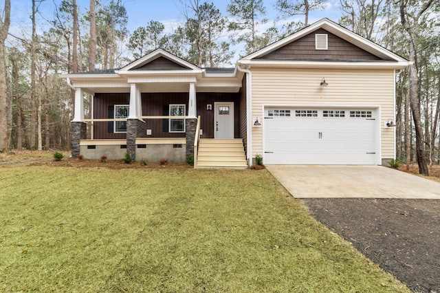 craftsman house featuring a garage, a front lawn, and a porch