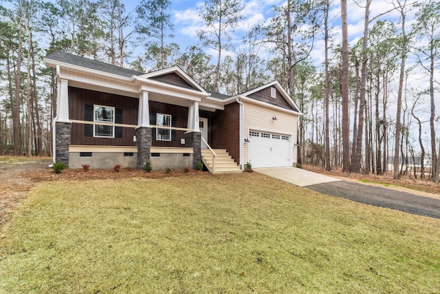 craftsman house featuring a porch, a garage, and a front lawn