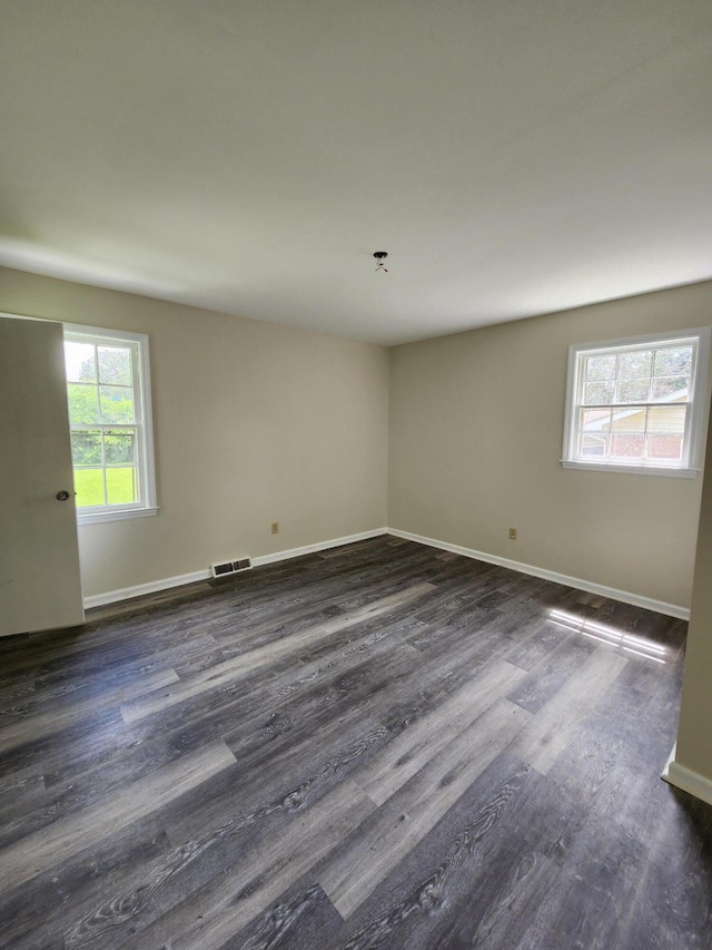 unfurnished room featuring hardwood / wood-style flooring