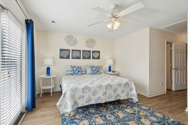 bedroom with light hardwood / wood-style flooring and ceiling fan