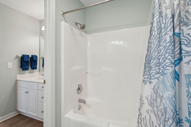 bathroom featuring vanity, hardwood / wood-style floors, and shower / bath combo