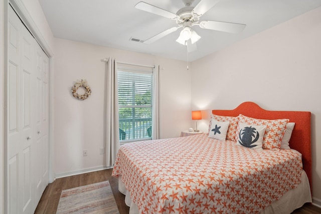 bedroom featuring dark hardwood / wood-style flooring, a closet, and ceiling fan