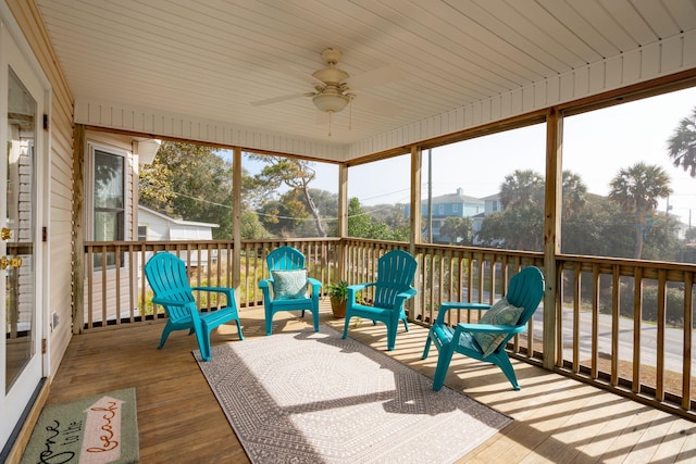 sunroom / solarium with ceiling fan