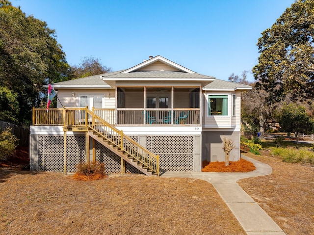 back of house featuring a wooden deck