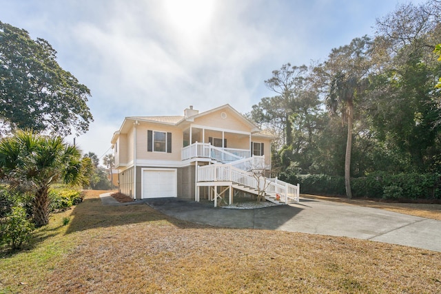 view of front of house with a garage and covered porch