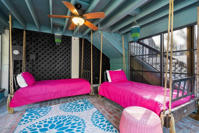 bedroom featuring vaulted ceiling with beams