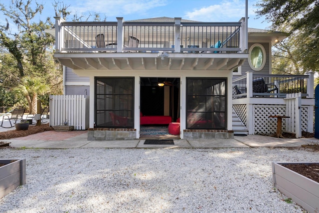 back of house featuring a balcony